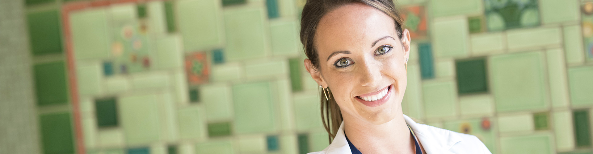 Female pharmacist smiling at the camera