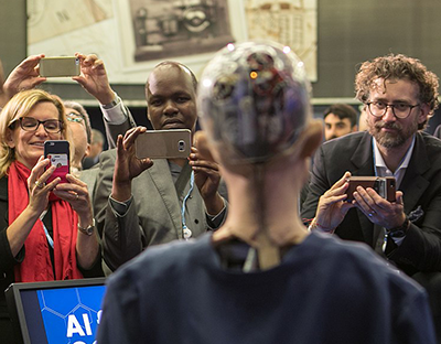Sophia the AI Robot facing a crowd. Credit: ITU Pictures from Geneva, Switzerland, AI for GOOD Global Summit (35173300465), CC BY 2.0